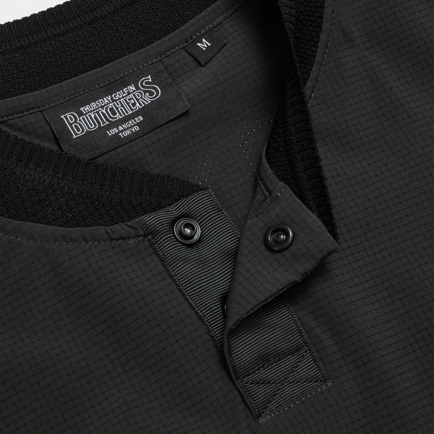 Hole In Fabric Solid Bomber